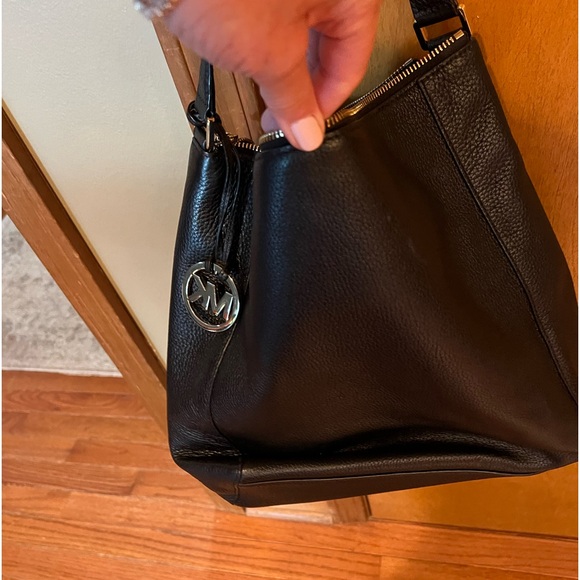 Black bag with gold hardware. - Picture 2 of 6